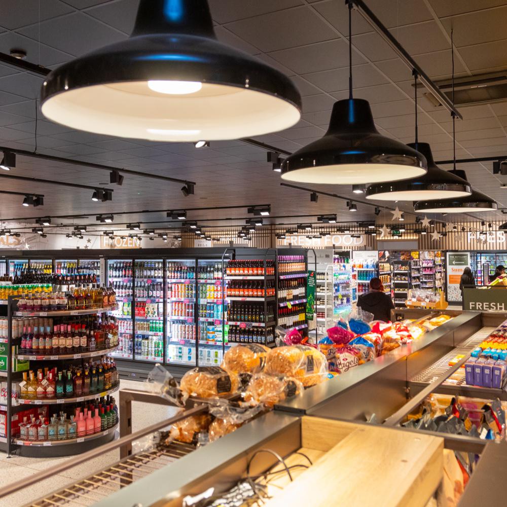 View of ailes and deli counter within a grocery store