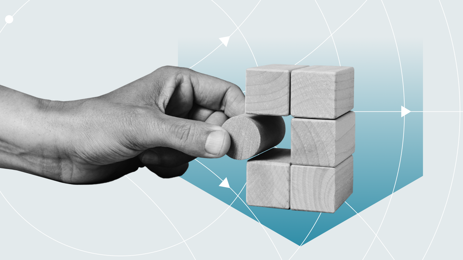 Image of a person fitting a round block into a set of composable wooden blocks.